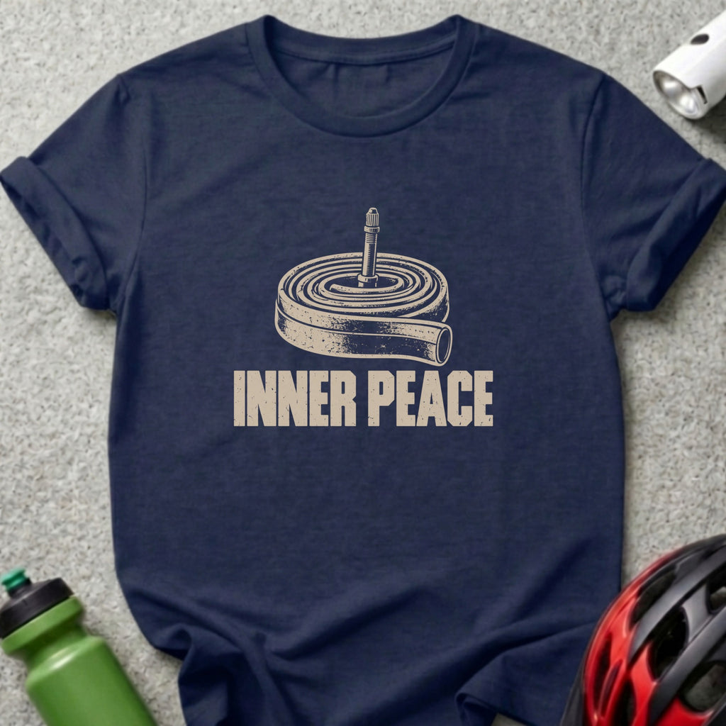 A dark blue t-shirt featuring a rolled bicycle inner tube graphic with the text INNER PEACE.