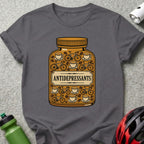 Gray t-shirt with "ANTIDEPRESSANTS" label on coffee cup and bicycle pill bottle graphic.