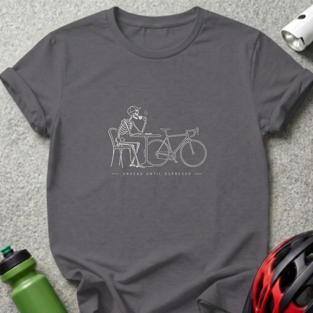 Dark gray t-shirt with a line drawing of a skeleton drinking coffee next to a bicycle.