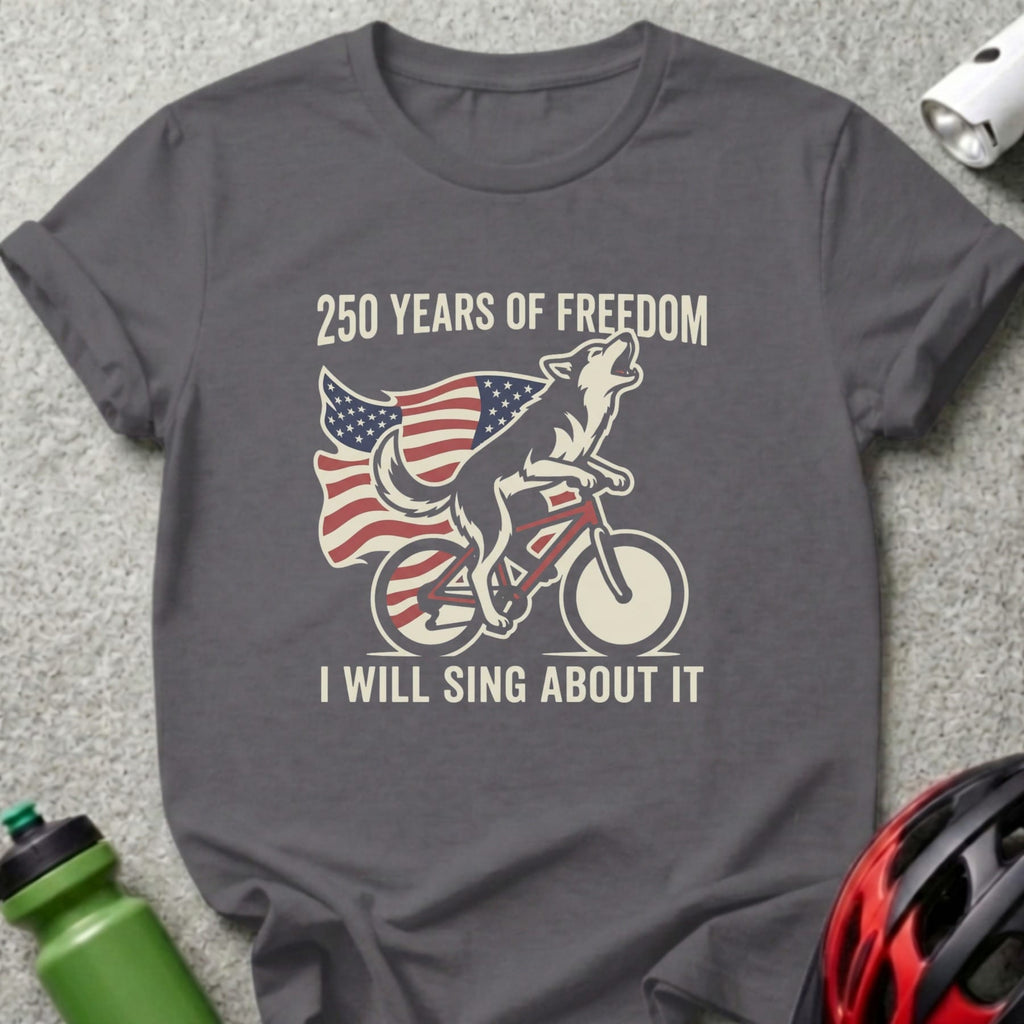 Wolf riding bicycle with American flag, text "250 YEARS OF FREEDOM I WILL SING ABOUT IT".