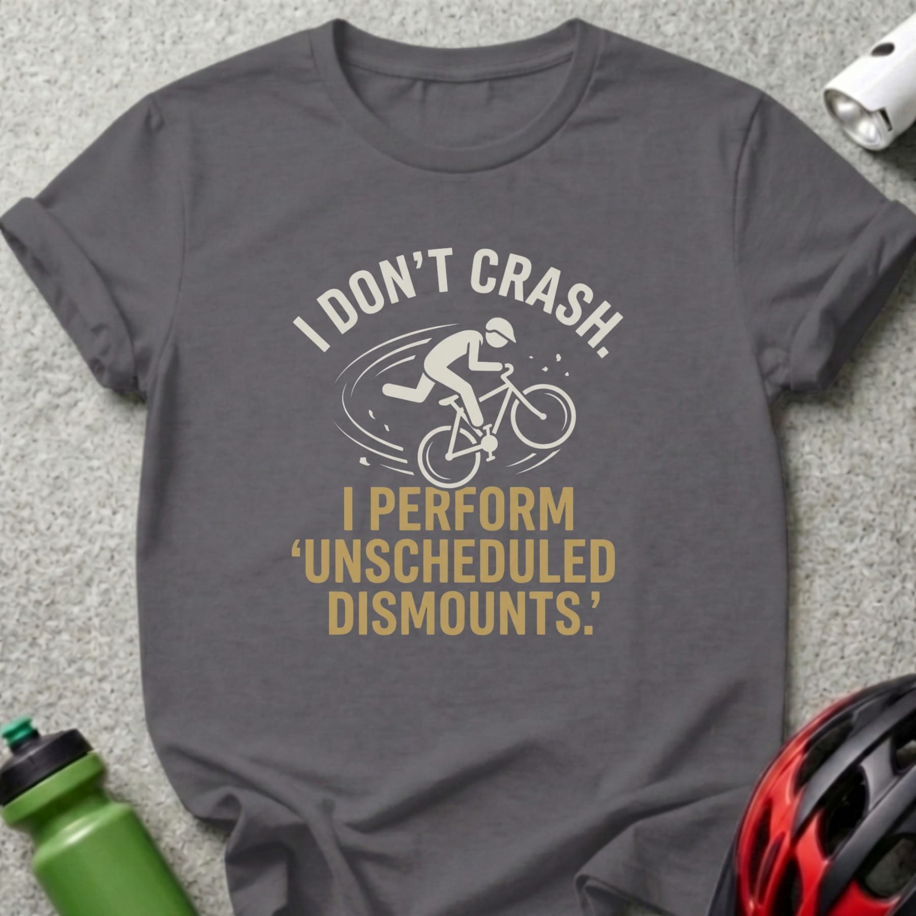 Dark grey t-shirt with "I don't crash. I perform 'unscheduled dismounts'." text.