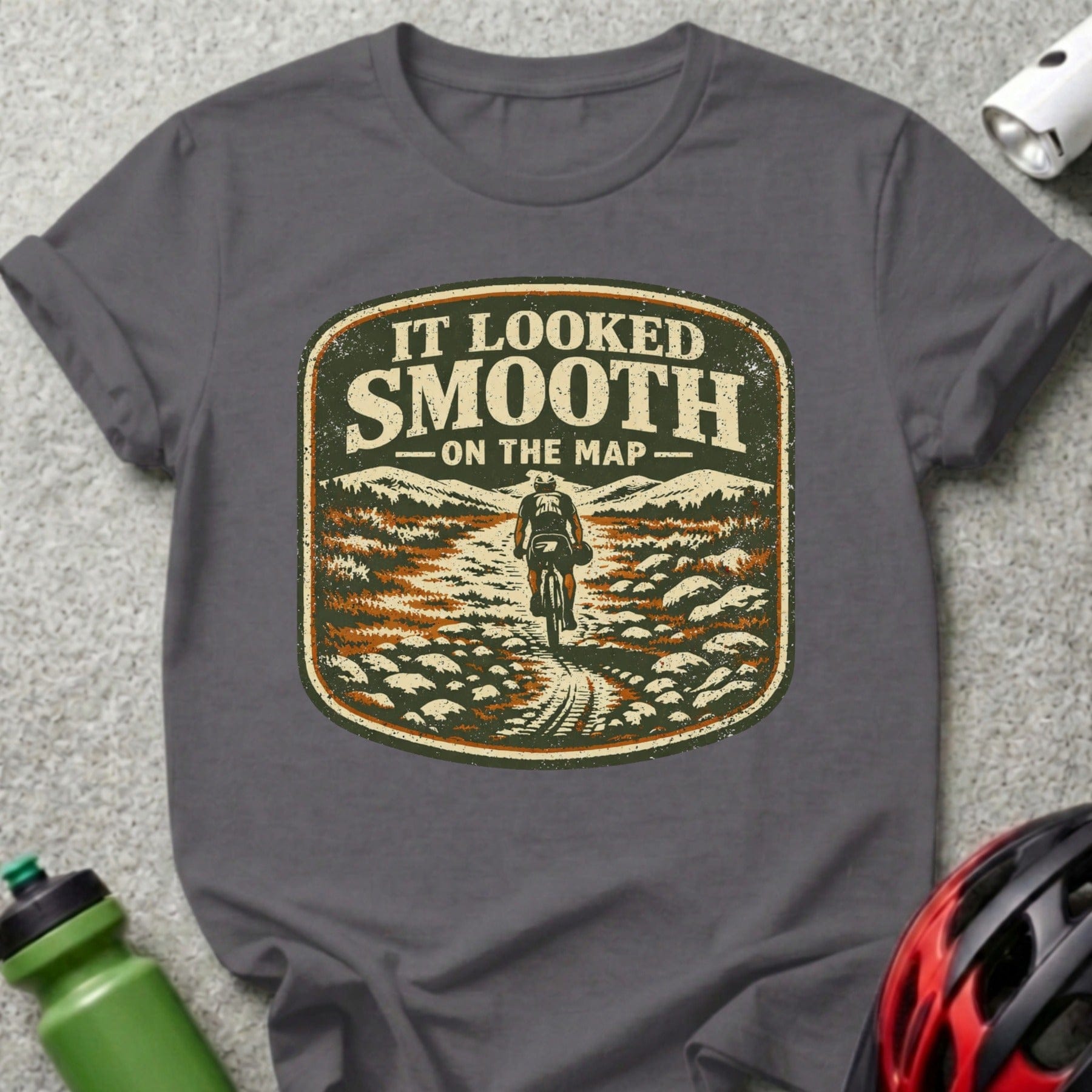 T-shirt with distressed graphic of a mountain biker on a trail.