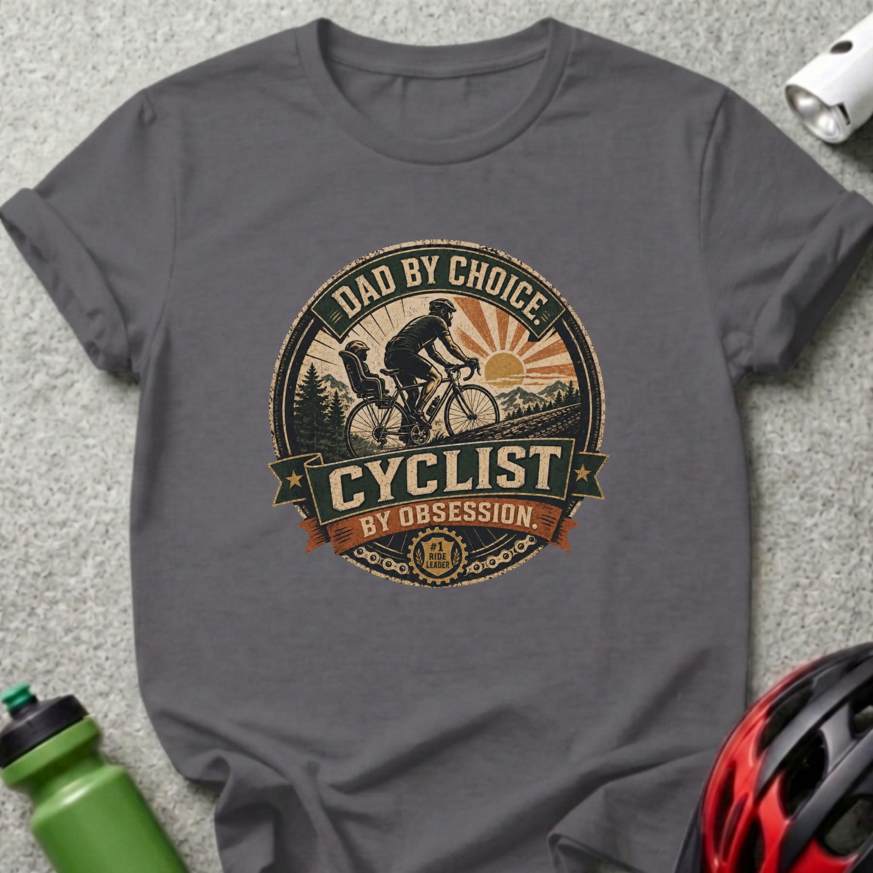 Dad by Choice, Cyclist by Obsession text on charcoal t-shirt with cyclist graphic.
