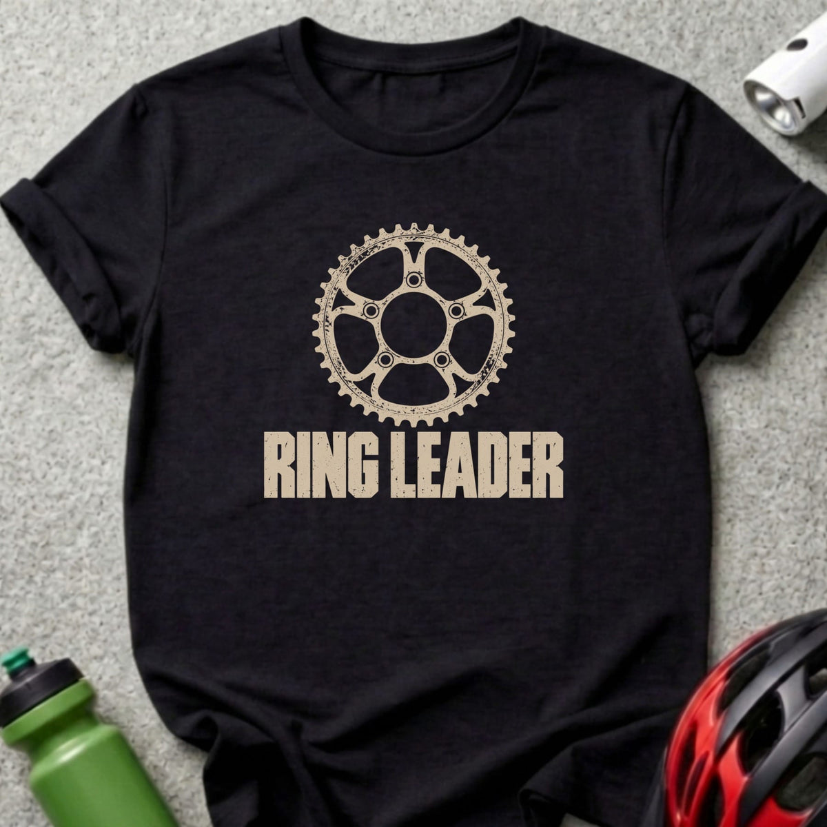 A black t-shirt features a tan bicycle chainring graphic above the text Ring Leader.