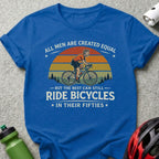Blue t-shirt with text "All Men Are Created Equal But The Best Can Still Ride Bicycles In Their Fifties".