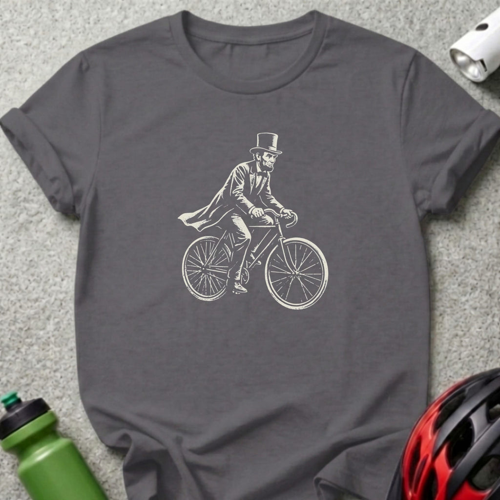 Skeleton in top hat riding bicycle, graphic on a dark gray t-shirt.