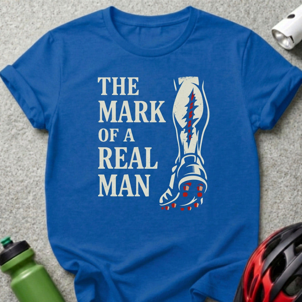 Blue t-shirt with "The Mark of a Real Man" and a leg graphic.