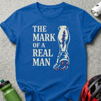 Blue t-shirt with "The Mark of a Real Man" and a leg graphic.