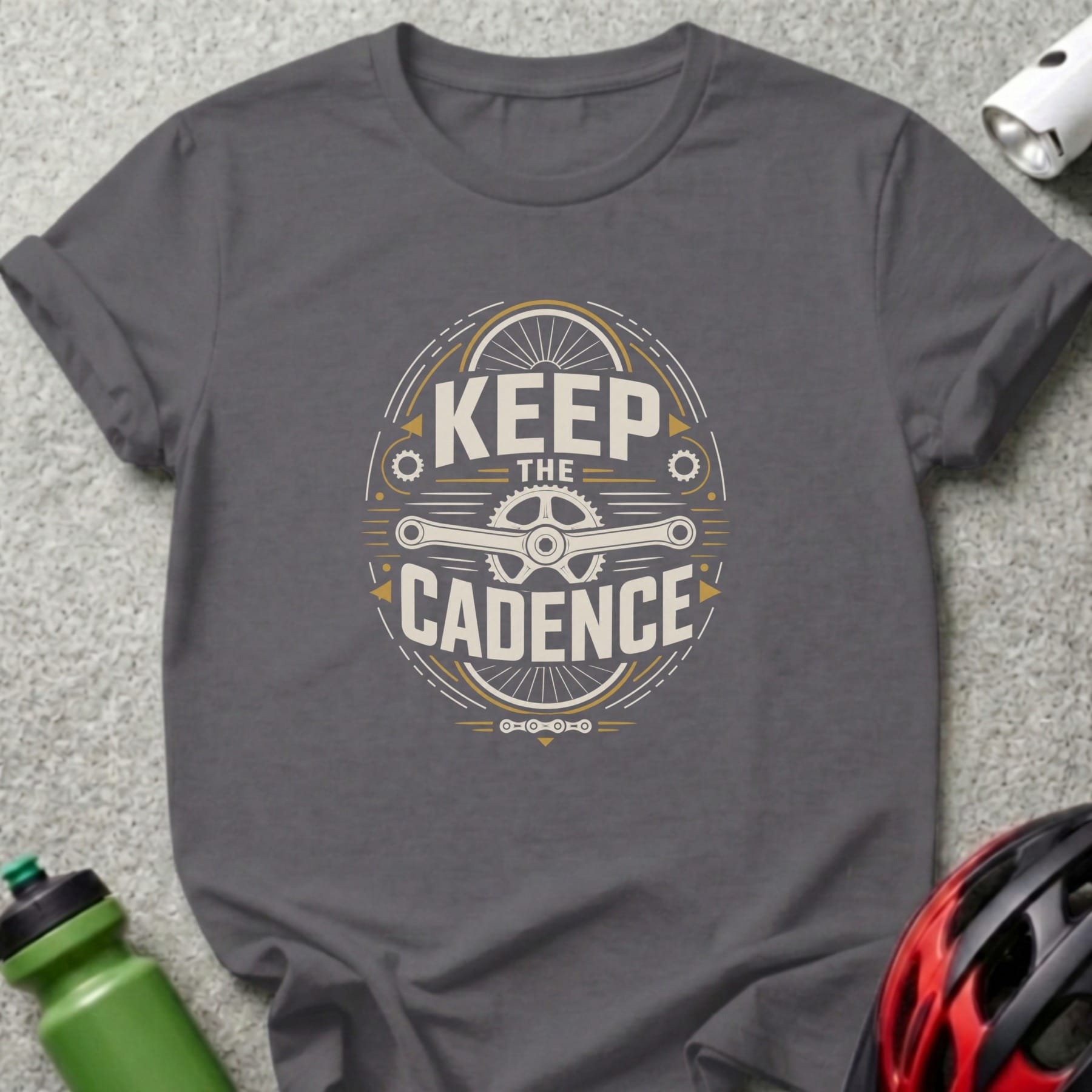 Dark gray t-shirt with "KEEP THE CADENCE" text and bicycle chainring graphic.