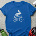 Blue crewneck t-shirt featuring a white graphic of a pelican riding a bicycle.