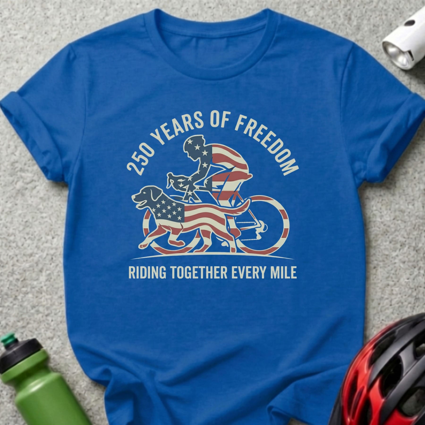 Blue t-shirt with cyclist and dog graphic, "250 Years of Freedom" and "Riding Together Every Mile".