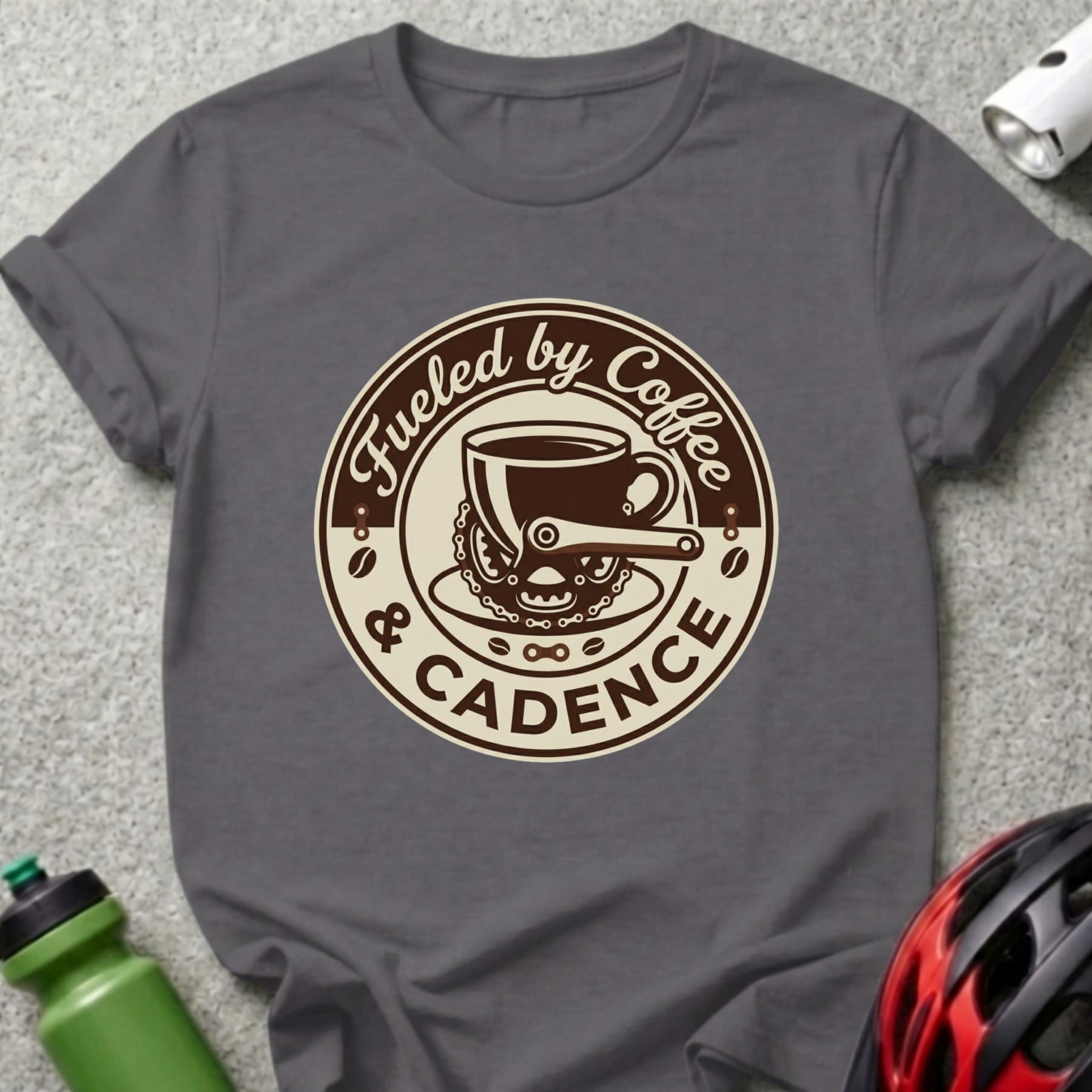 Dark gray t-shirt with "Fueled by Coffee & Cadence" circular coffee cup and bicycle chain graphic.