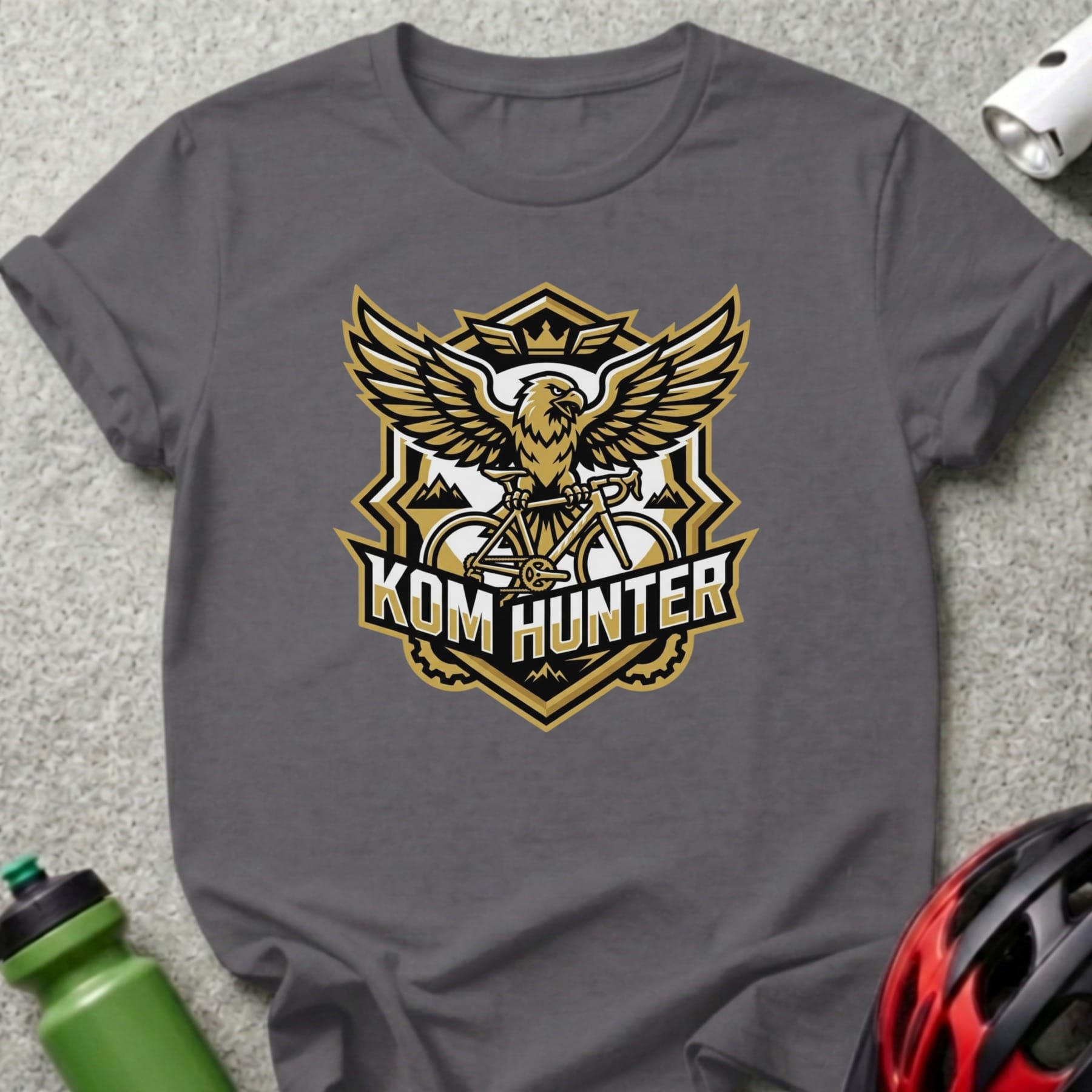 Grey t-shirt with KOM HUNTER eagle and bicycle logo.