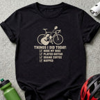 Black t-shirt featuring graphic text and illustrations of a bicycle and guitar.