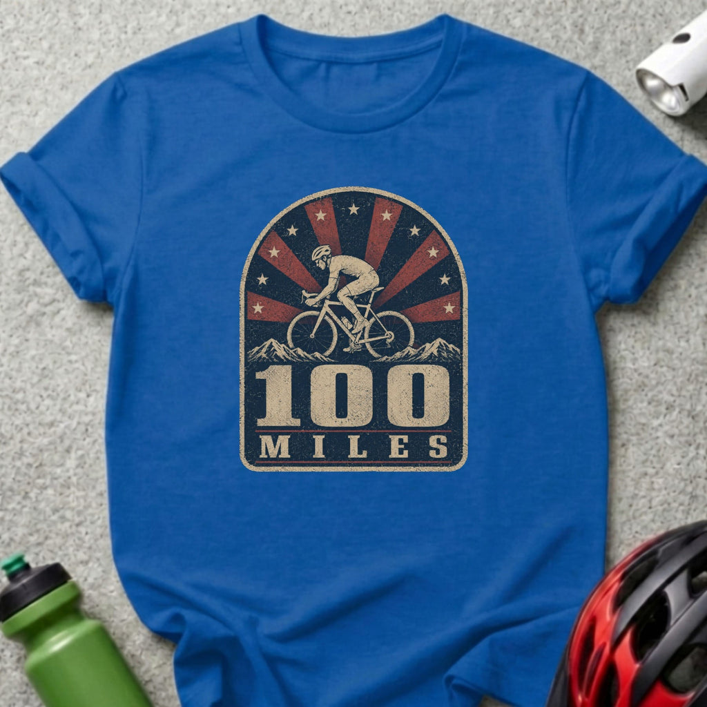 Blue t-shirt with distressed graphic of cyclist, mountains, and text "100 MILES".