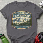 Mountain biker sticker on dark gray t-shirt, "It looked flat on the map"
