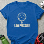 A blue crewneck t-shirt featuring a white pressure gauge graphic with the text LOW PRESSURE below it.