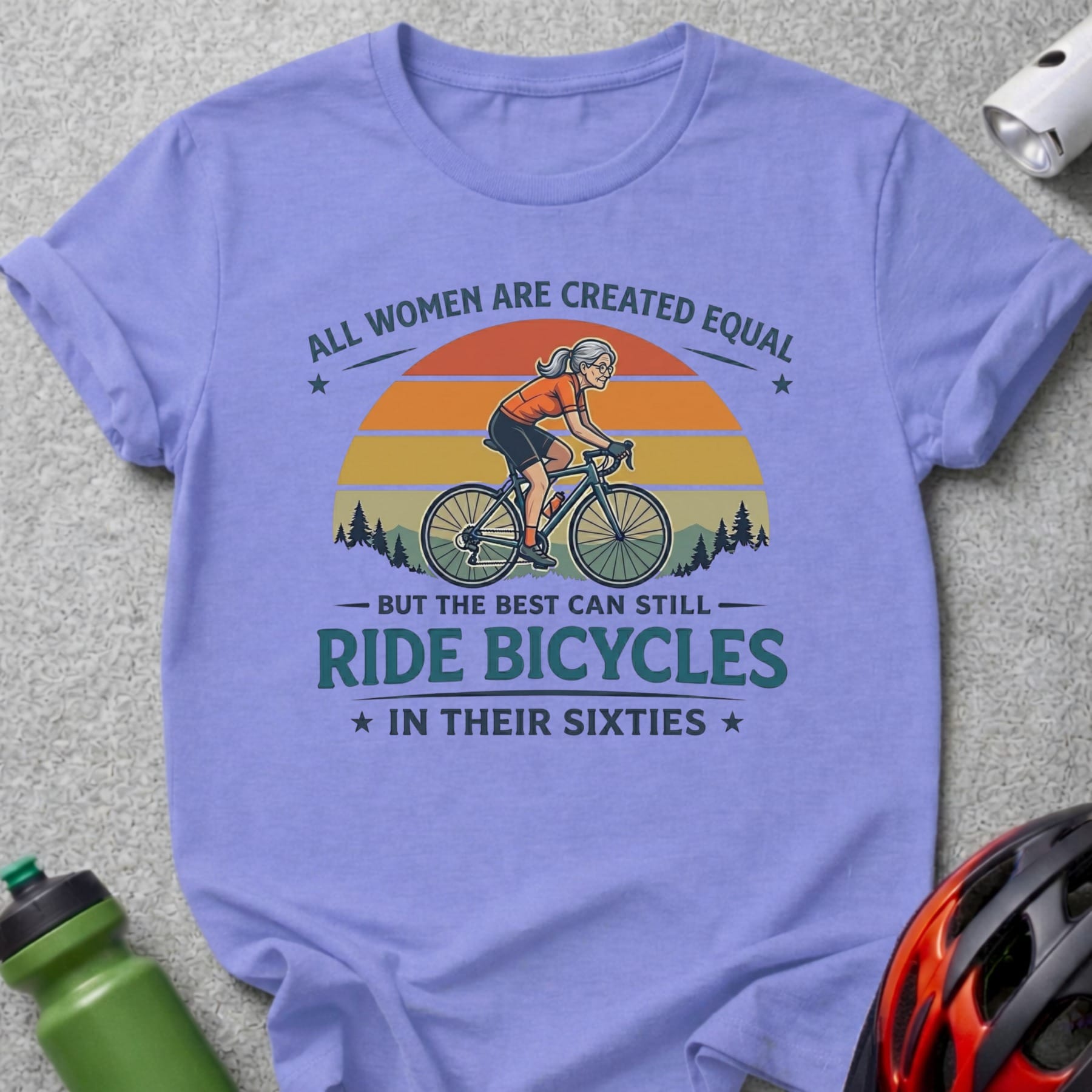 Purple t-shirt with "All women are created equal but the best can still ride bicycles in their sixties" text.