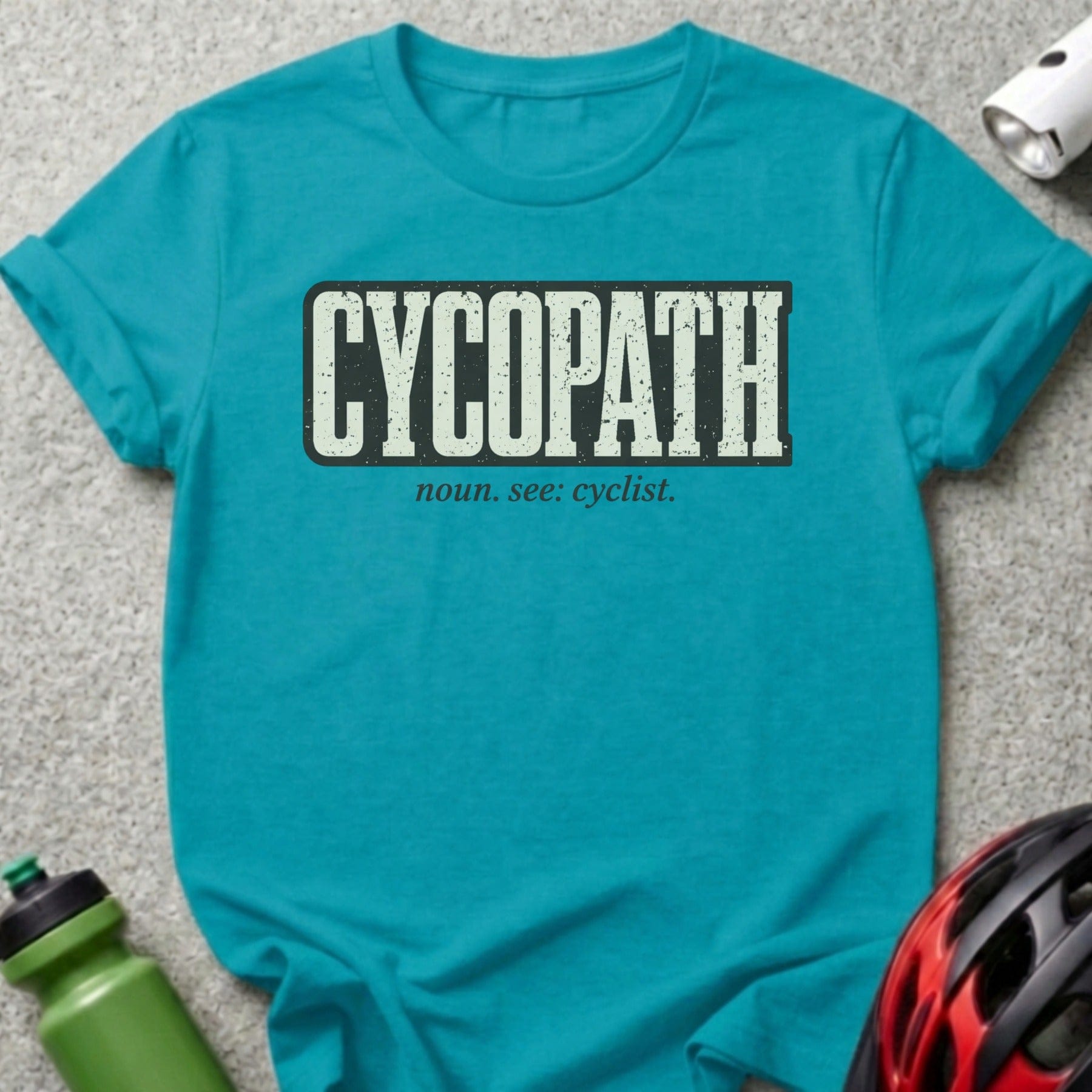 Teal t-shirt with "CYCOPATH" and "noun: see: cyclist." text.