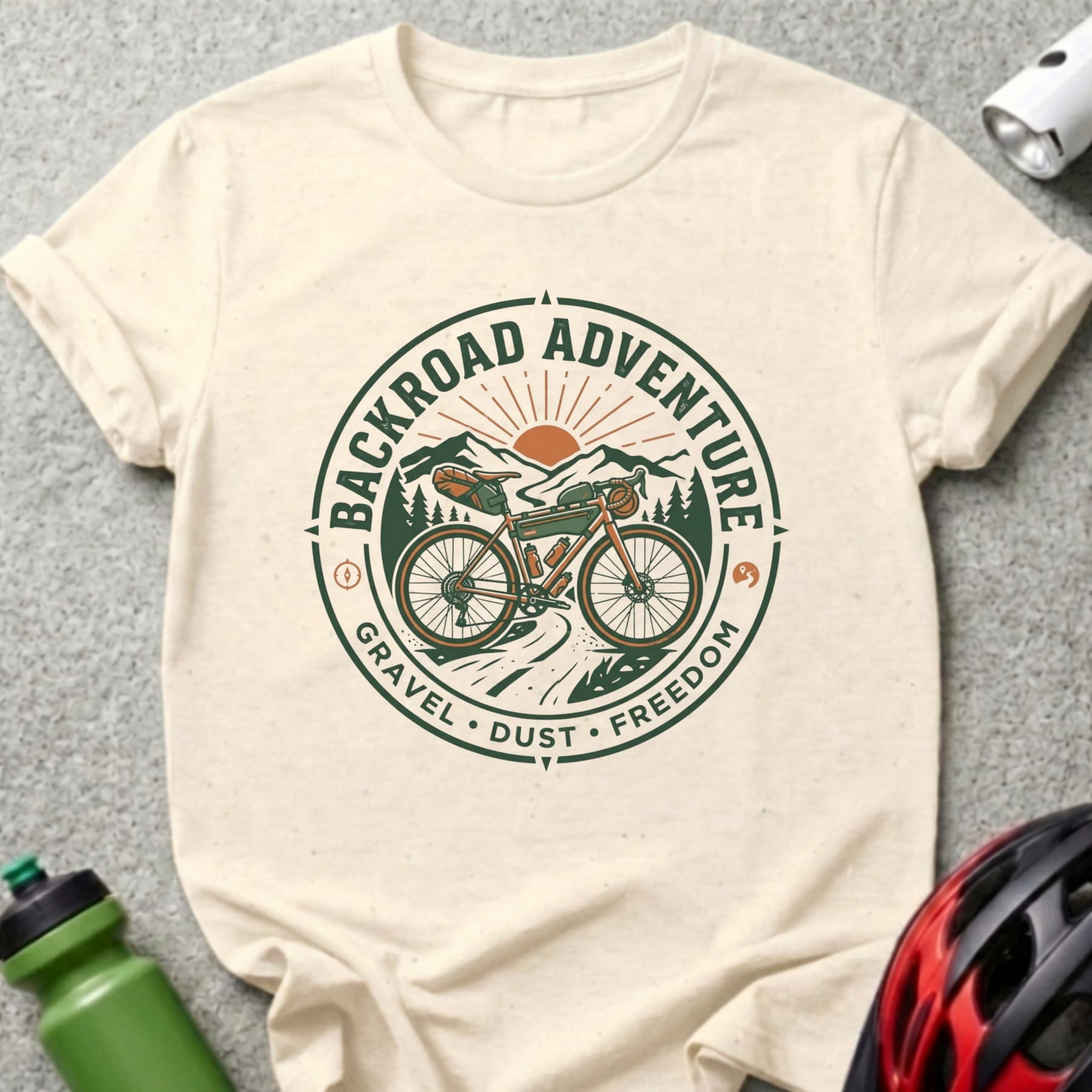 Gravel bike with mountains and sun graphic on cream t-shirt.