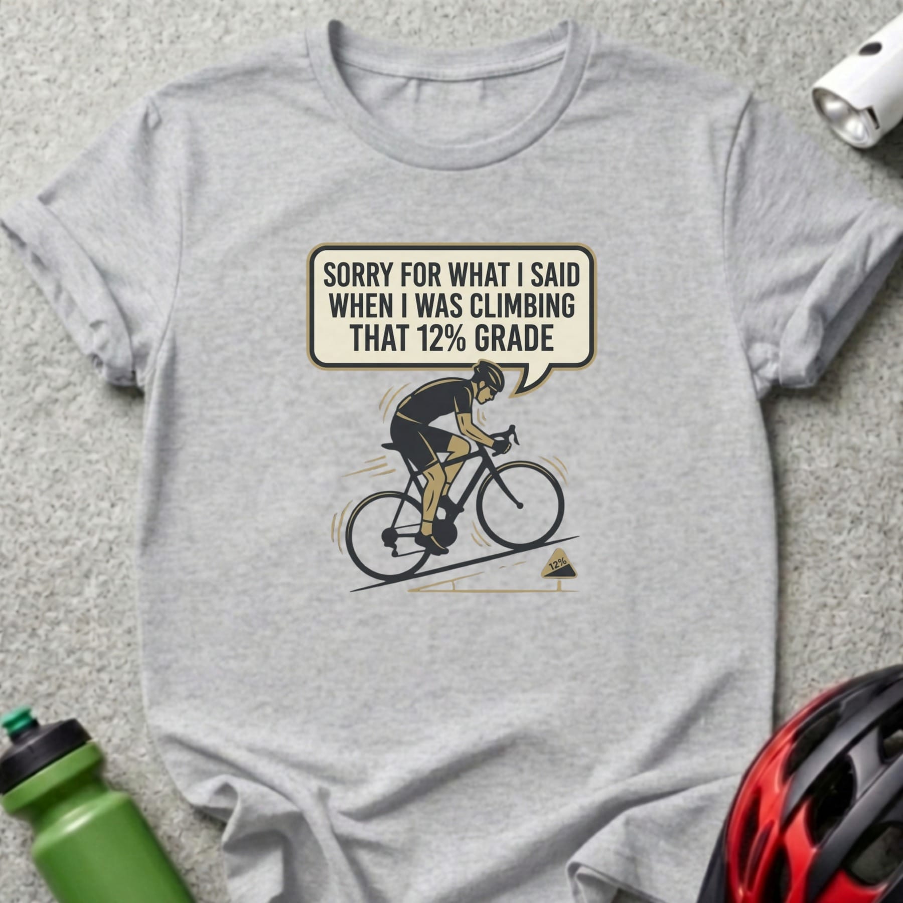 Cyclist on a bike with speech bubble saying "Sorry for what I said when I was climbing that 12% grade."