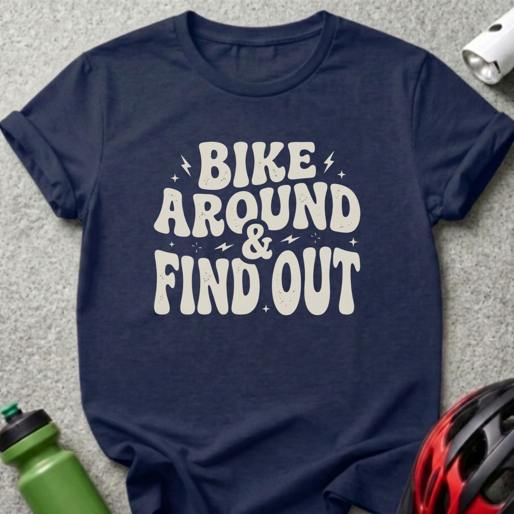 Navy t-shirt with "BIKE AROUND & FIND OUT" text and a bicycle helmet and water bottle.