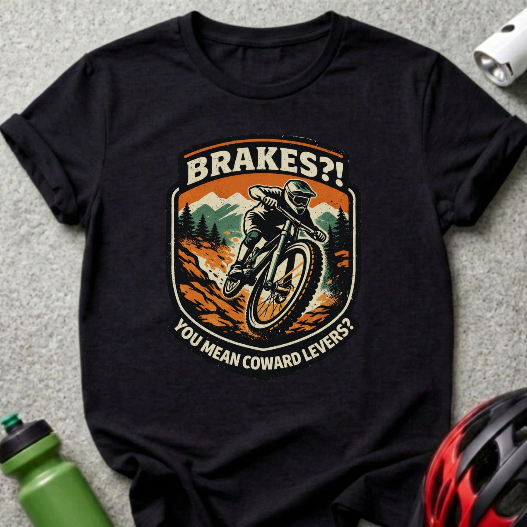 Mountain biker on downhill trail with "BRAKES?! YOU MEAN COWARD LEVERS?" text.