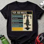 T-shirt with bicycle graphic and text about riding 100 miles.
