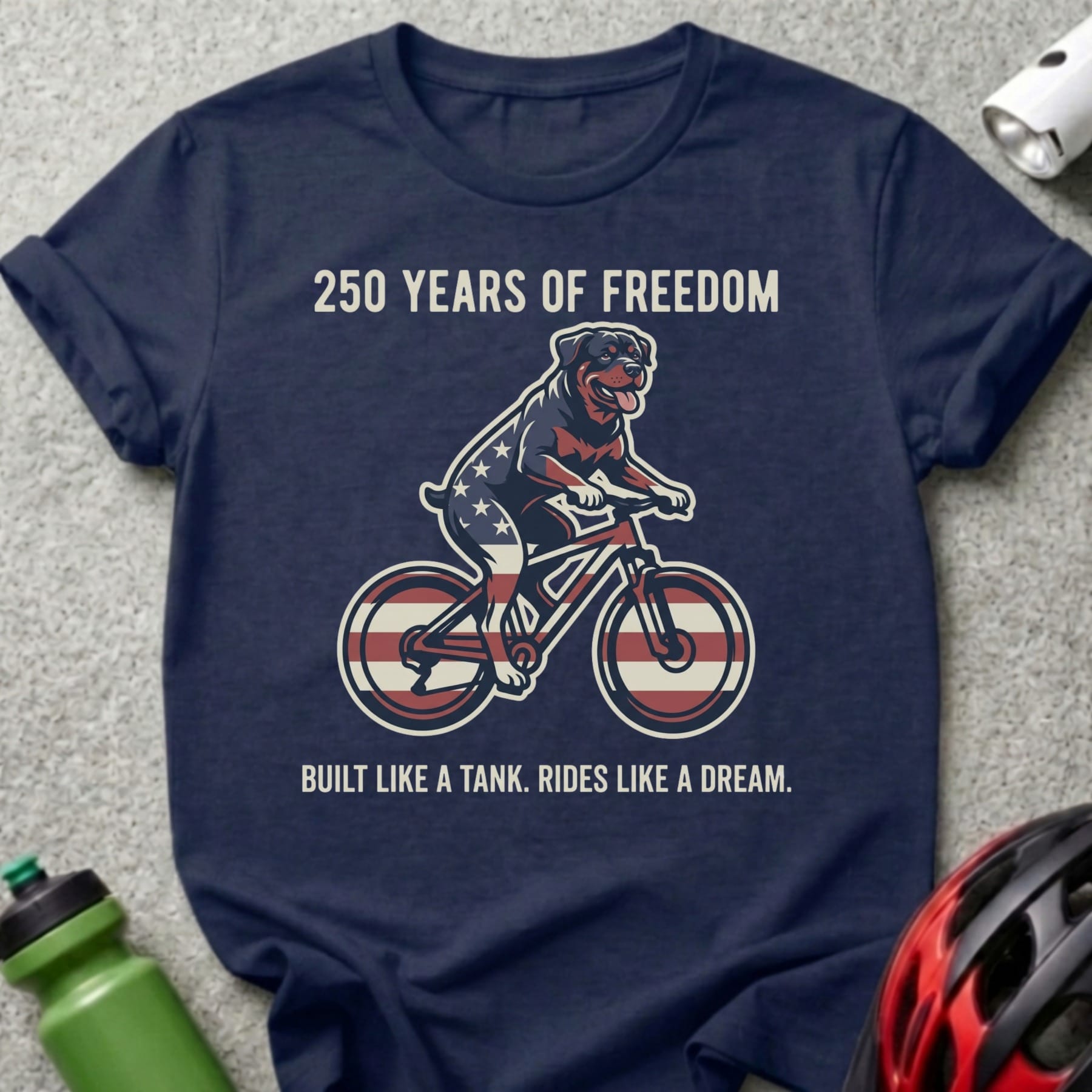 Rottweiler on a bicycle with "250 Years of Freedom" text.