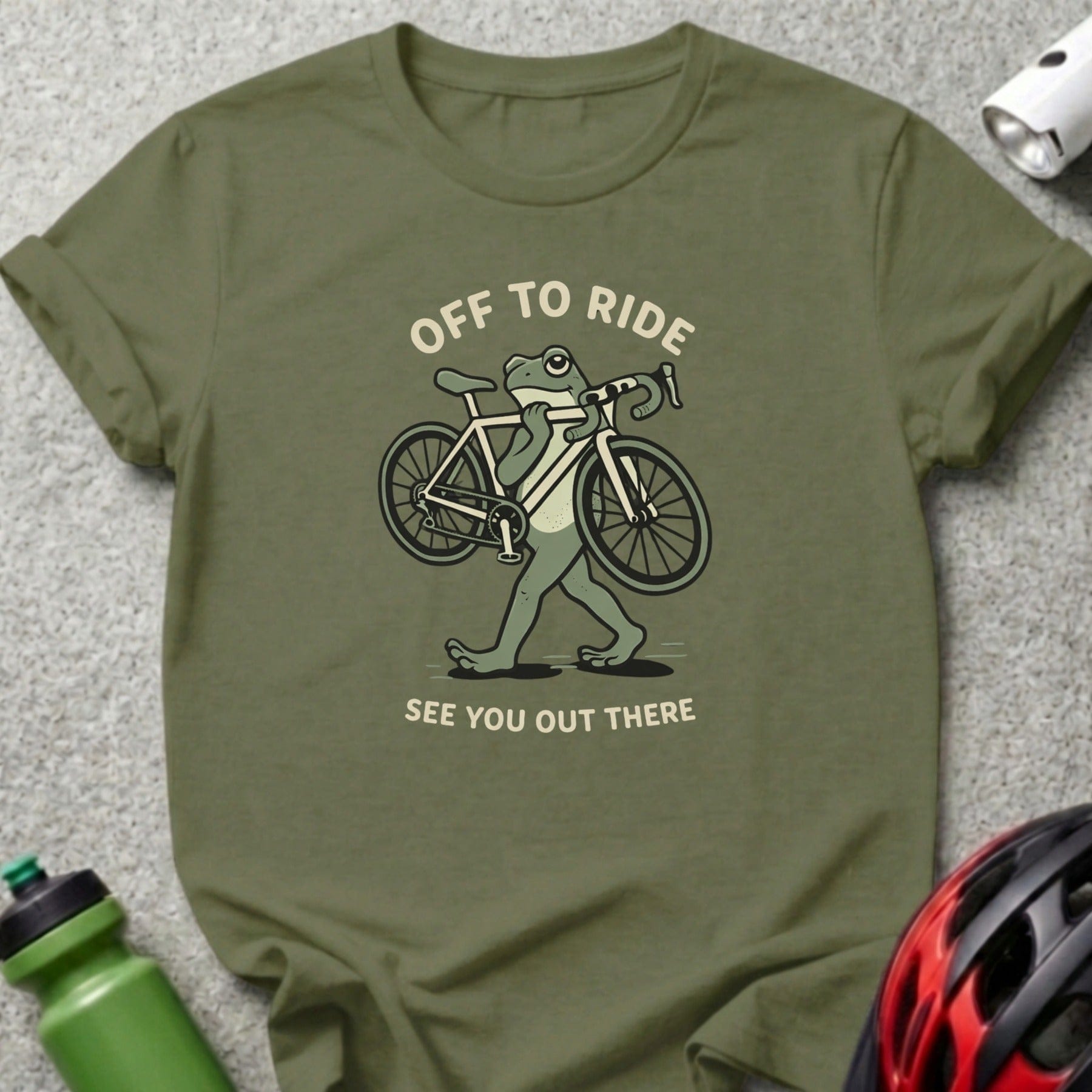 Frog carrying a bicycle with text "Off to Ride" and "See You Out There".