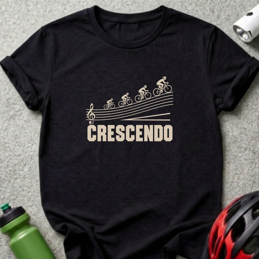 A black short-sleeved t-shirt featuring a graphic of four cyclists ascending musical staff lines with the text CRESCENDO.