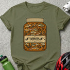 Green t-shirt with a jar of bicycles and sneakers labeled "Antidepressants".