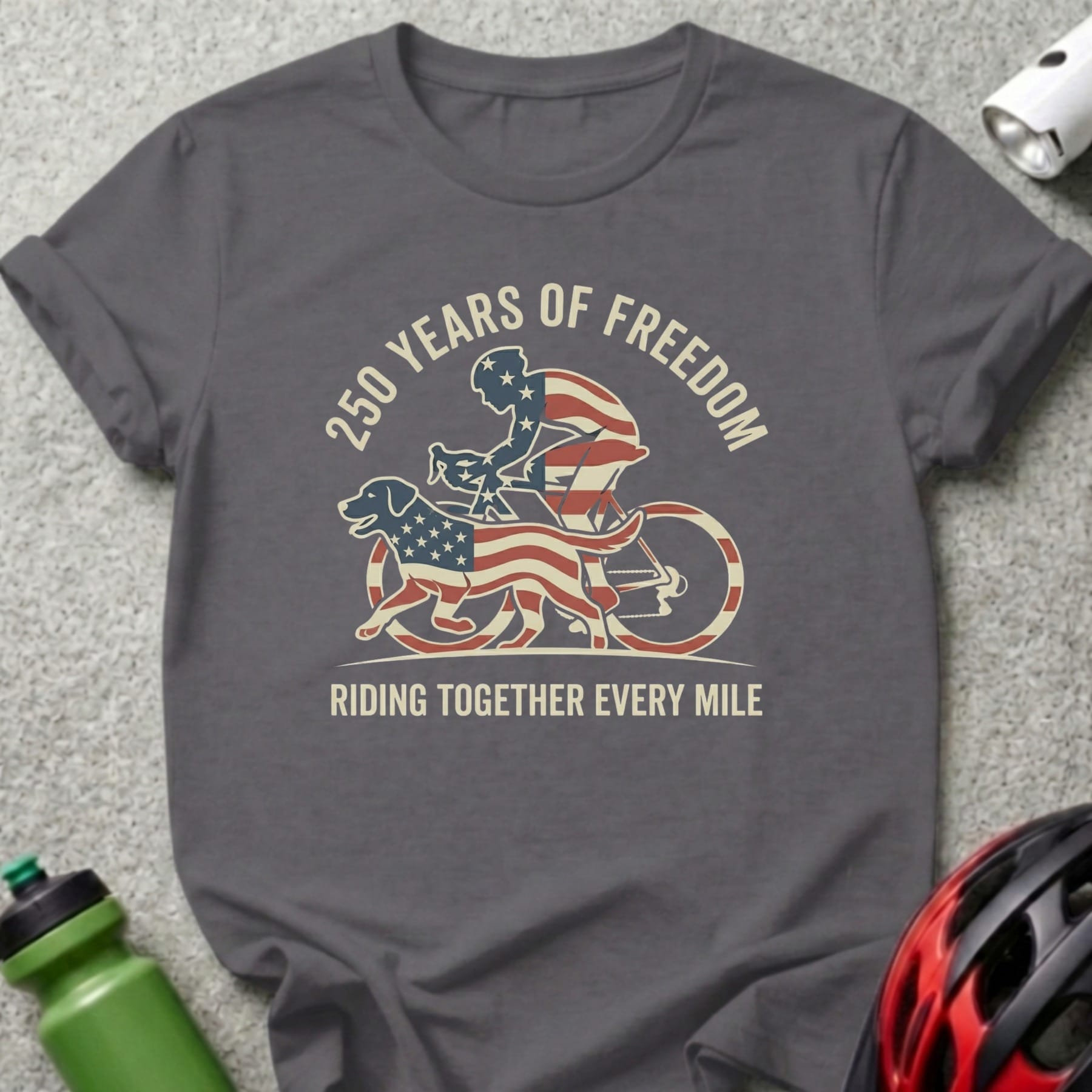 Gray t-shirt with patriotic cyclist and dog graphic and text.