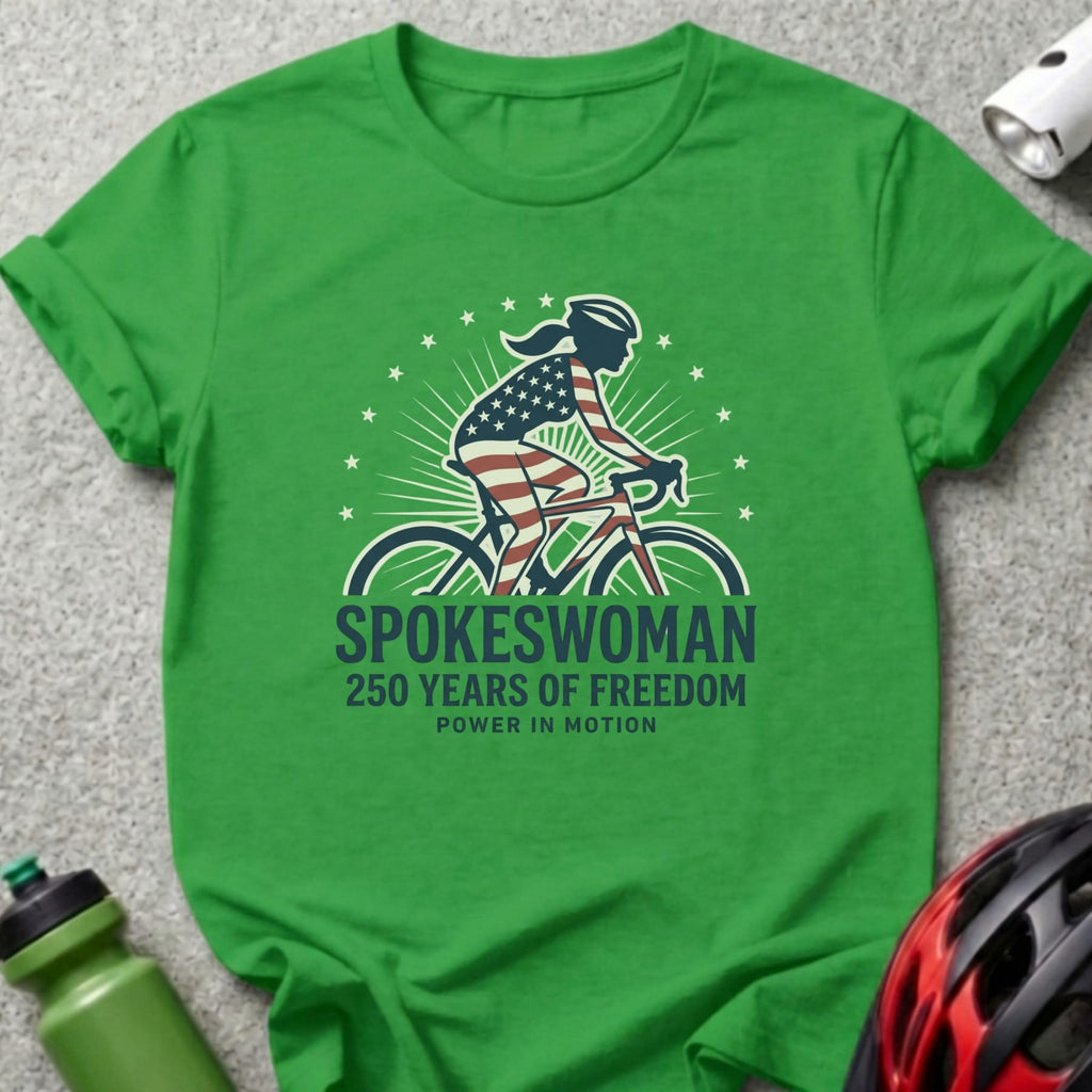 Green t-shirt with "Spokeswoman 250 Years of Freedom Power in Motion" text.
