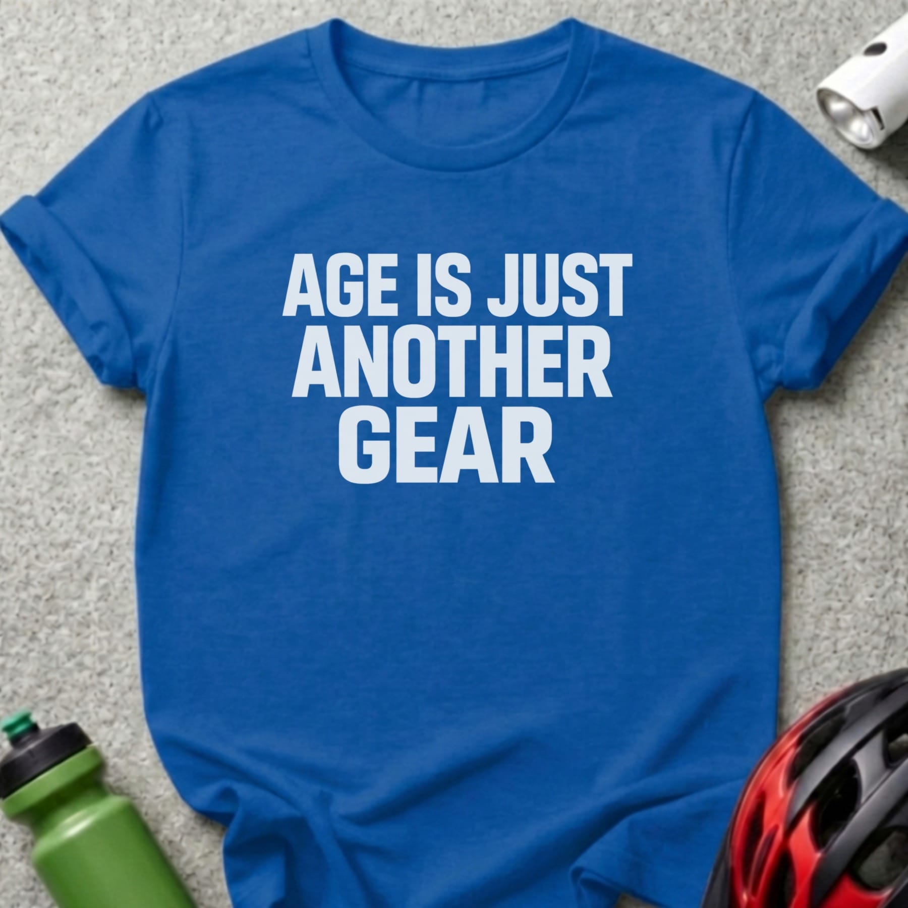 Blue t-shirt with "AGE IS JUST ANOTHER GEAR" in white text.
