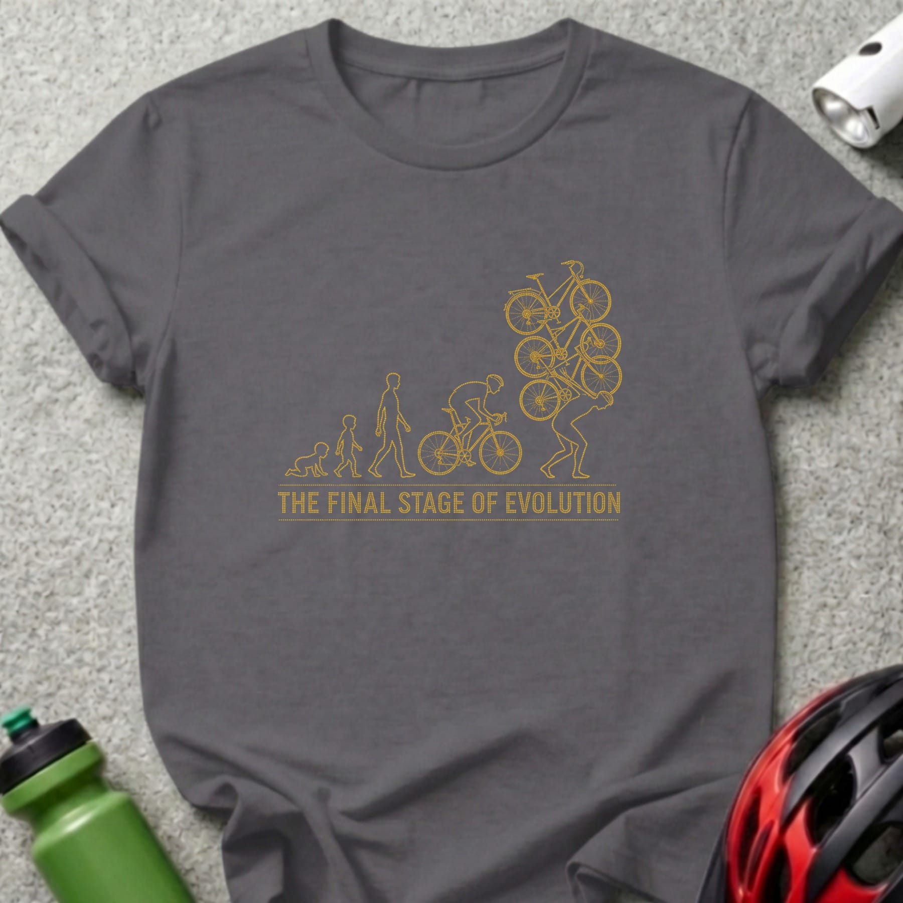 Dark gray t-shirt with yellow graphic showing human evolution culminating with bikes.