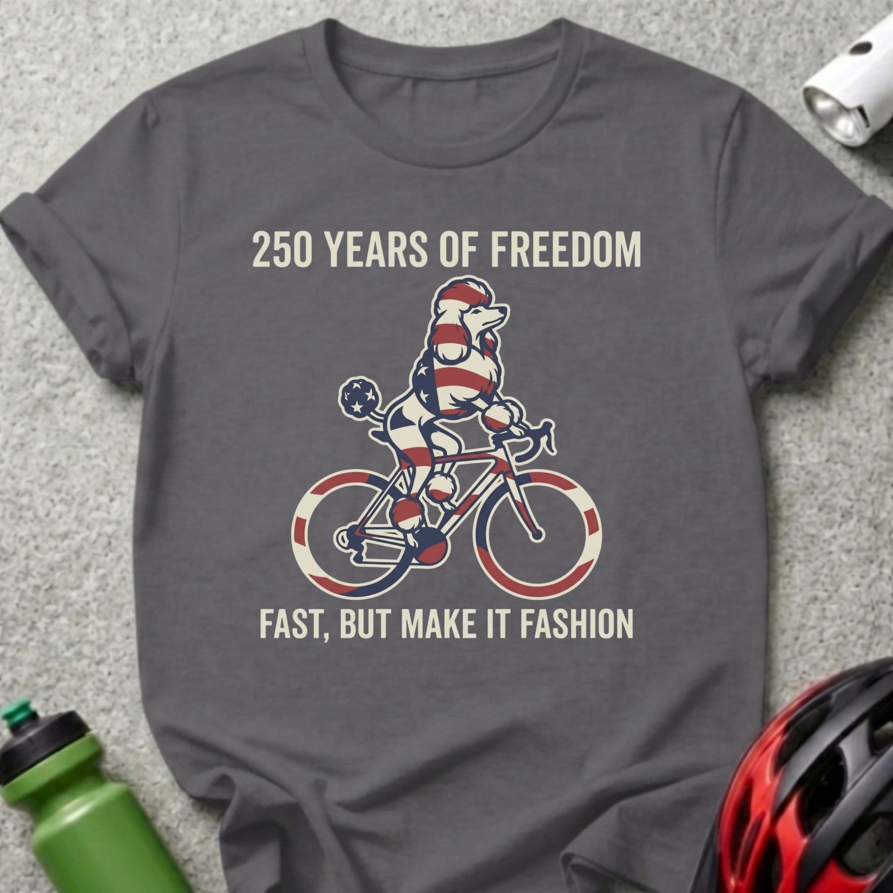 Poodle wearing a bandana rides a bicycle with patriotic colors.