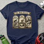 T-shirt with "The Holy Trinity" text and panels showing cycling, eating pasta, and sleeping.