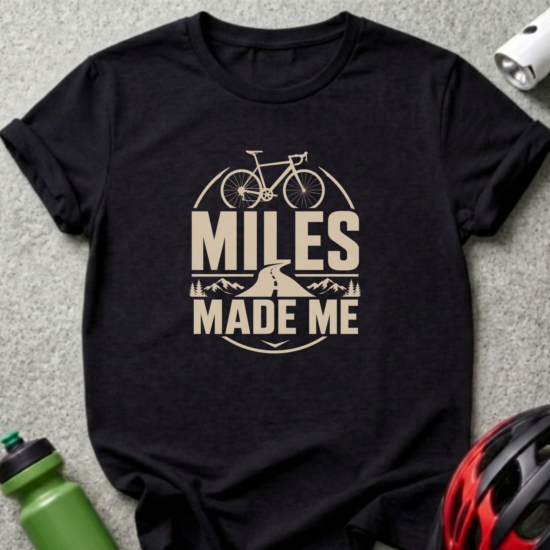 Black t-shirt with "Miles Made Me" text and bicycle graphic.