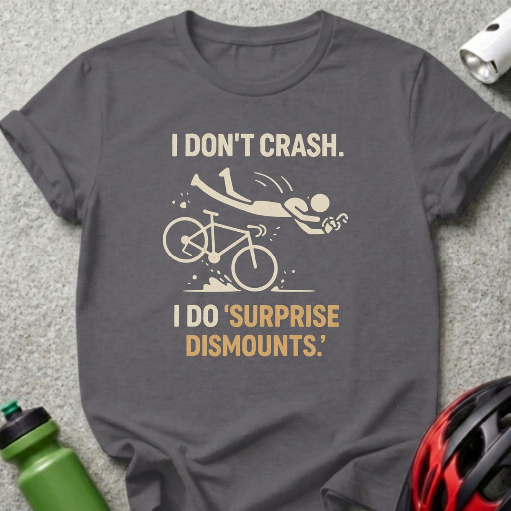 Dark grey t-shirt with "I DON'T CRASH. I DO 'SURPRISE DISMOUNTS.'" and bicycle graphic.