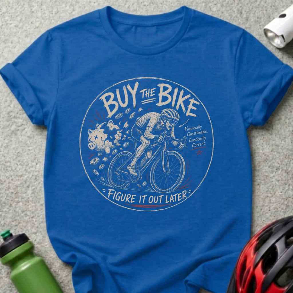 Blue t-shirt with graphic of cyclist, piggy bank, and text "Buy The Bike. Financially Questionable. Emotionally Correct. Figure It Out Later."