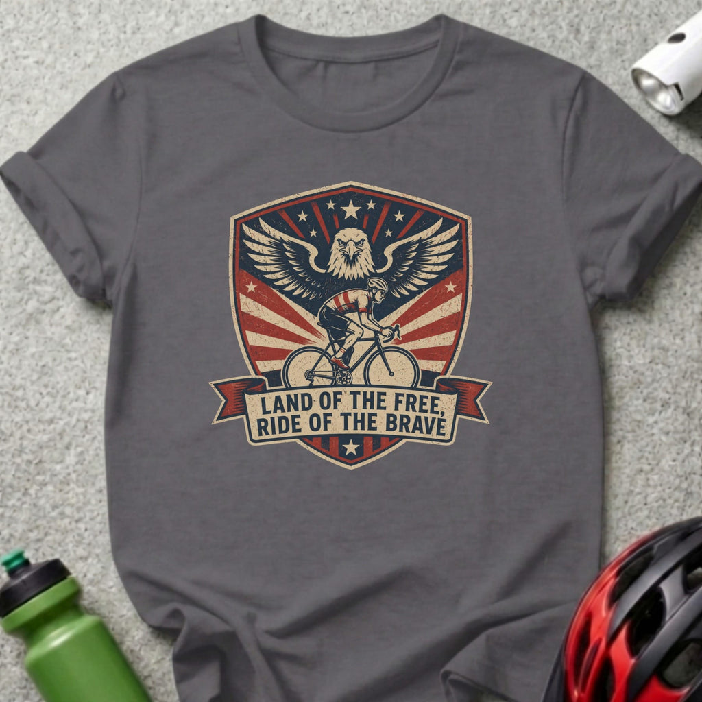 Grey t-shirt with patriotic eagle and cyclist graphic, reading "Land of the Free, Ride of the Brave".