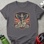Grey t-shirt with patriotic eagle and cyclist graphic, reading "Land of the Free, Ride of the Brave".
