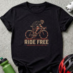 Black t-shirt with cyclist graphic and text "RIDE FREE AMERICAN CYCLING CO."