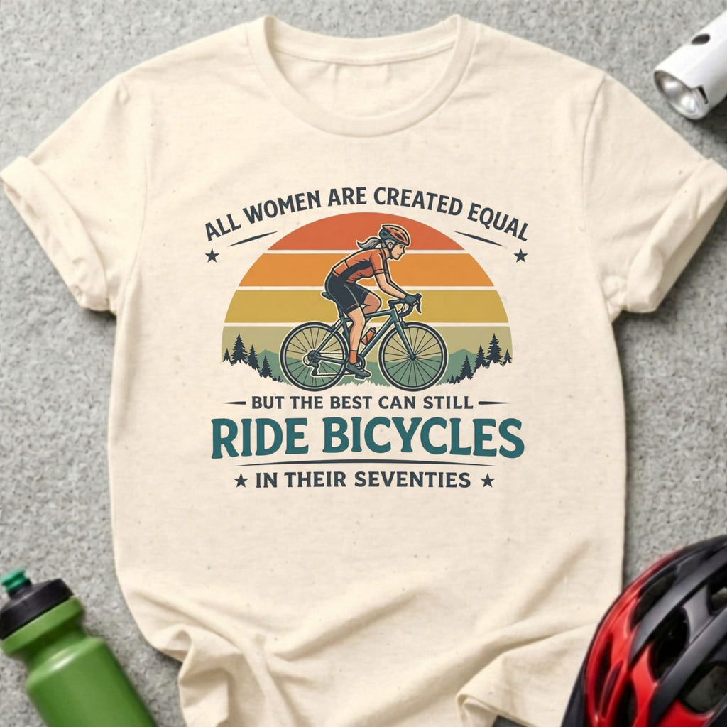 Cream t-shirt with text and graphic of woman cycling at sunset.