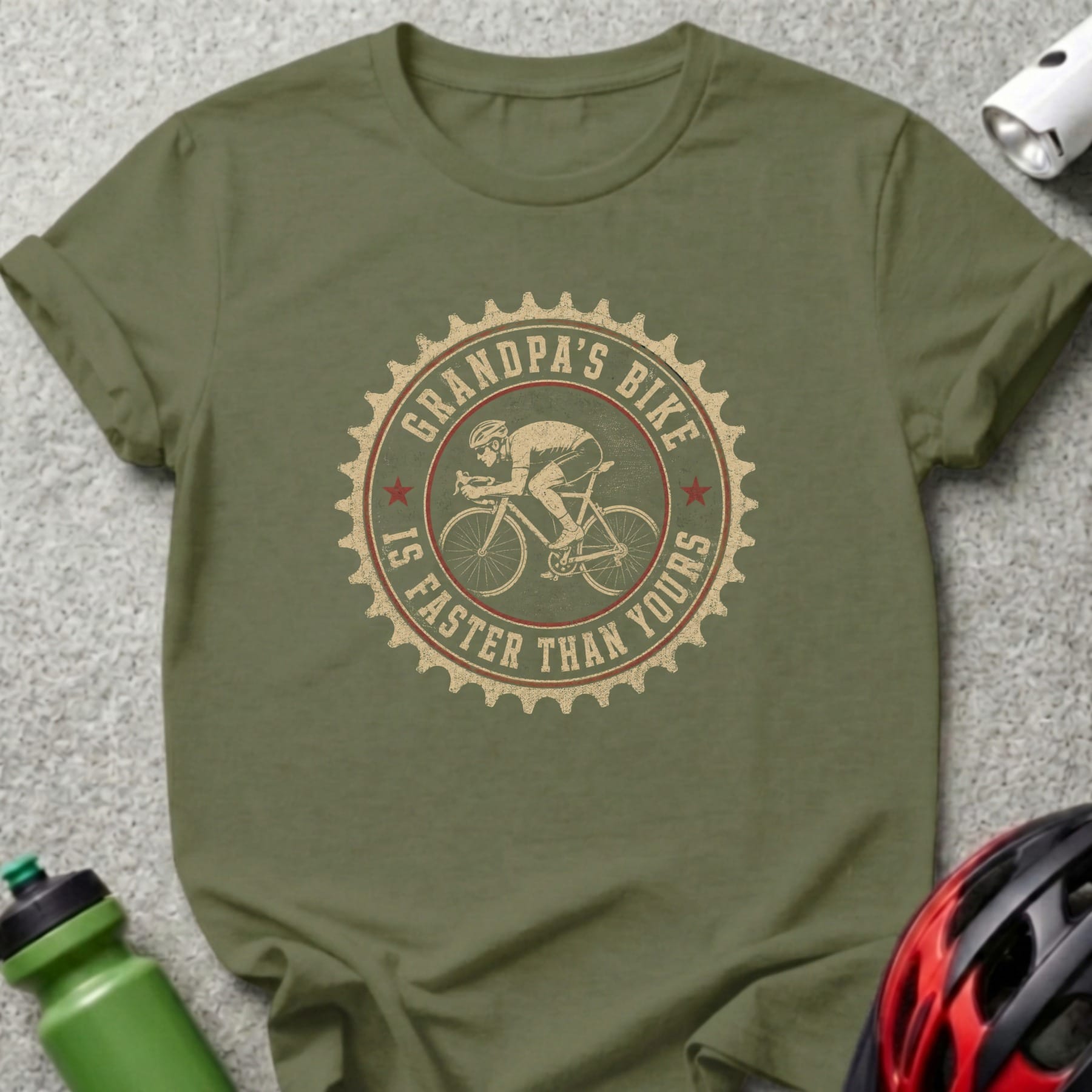 Green t-shirt with circular graphic of a cyclist and text "Grandpa's Bike Is Faster Than Yours".