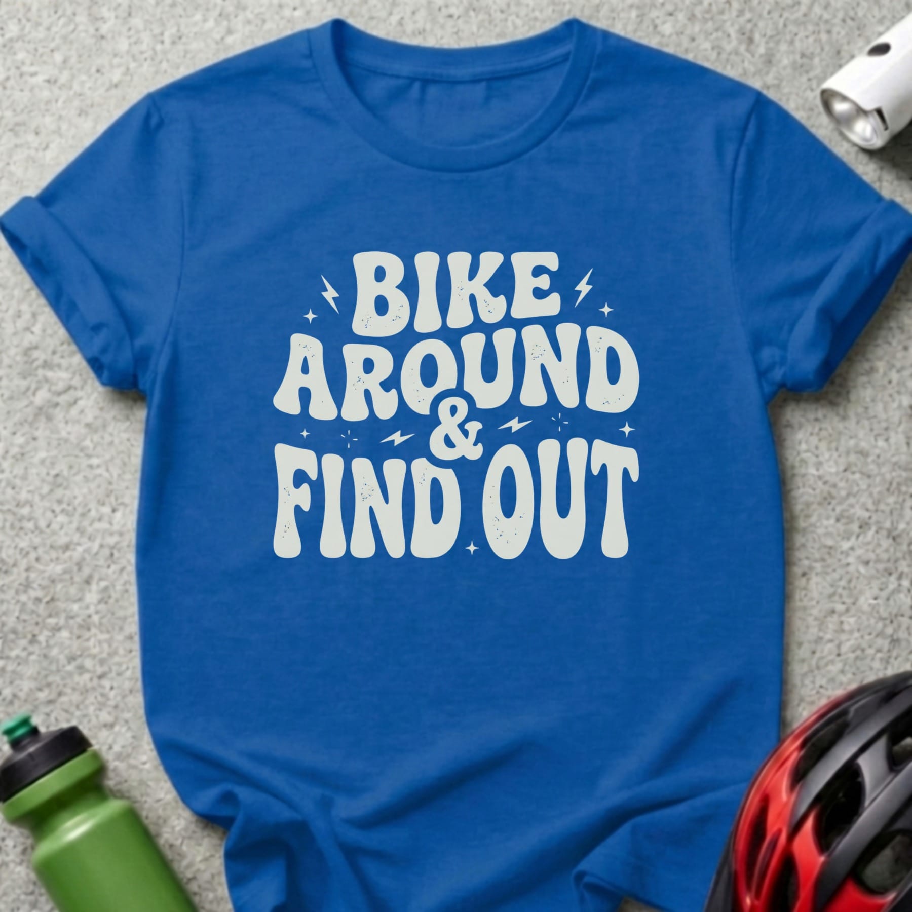 Blue t-shirt with "BIKE AROUND & FIND OUT" text.