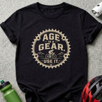 Black t-shirt with text "Age is a gear. Use it." and cyclist graphic.