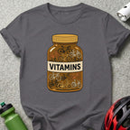 T-shirt graphic of a pill bottle filled with small bicycles, labeled "VITAMINS".