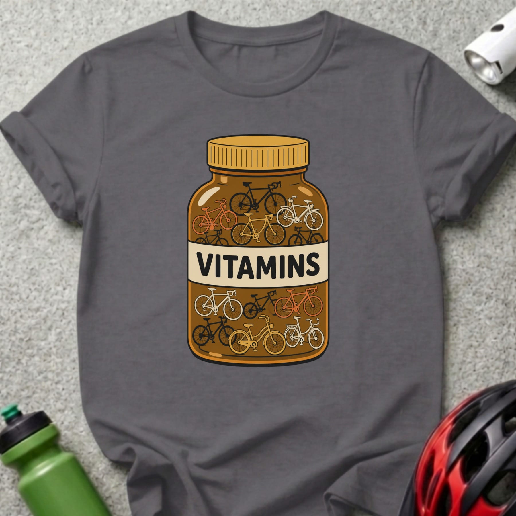 T-shirt graphic of a pill bottle filled with small bicycles, labeled "VITAMINS".